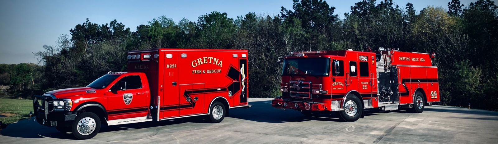 Modern Gretna Fire & Rescue ambulance and fire engine parked side by side